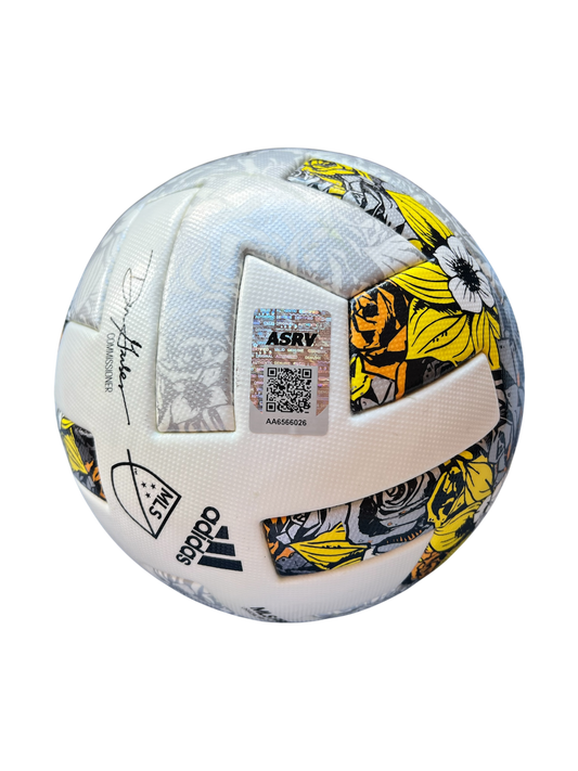 Soccer ball with floral patterns and Adidas branding on a white background